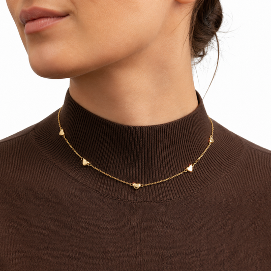 Elegant gold heart station necklace and bracelet set featuring delicate heart charms. Lightweight, minimalist, and perfect for everyday wear or gifting.