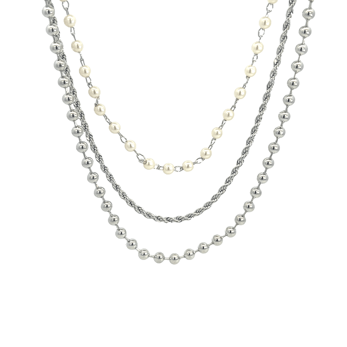 A layered silver necklace combines delicate pearl strands, a twisted rope chain, and polished metal beads against a clean white background.