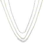 Modern triple layer necklace with paperclip, baguette and beaded chains. Minimalist layered jewelry available in gold or silver. Perfect for everyday wear.