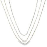 Modern triple layer necklace with paperclip, baguette and beaded chains. Minimalist layered jewelry available in gold or silver. Perfect for everyday wear.