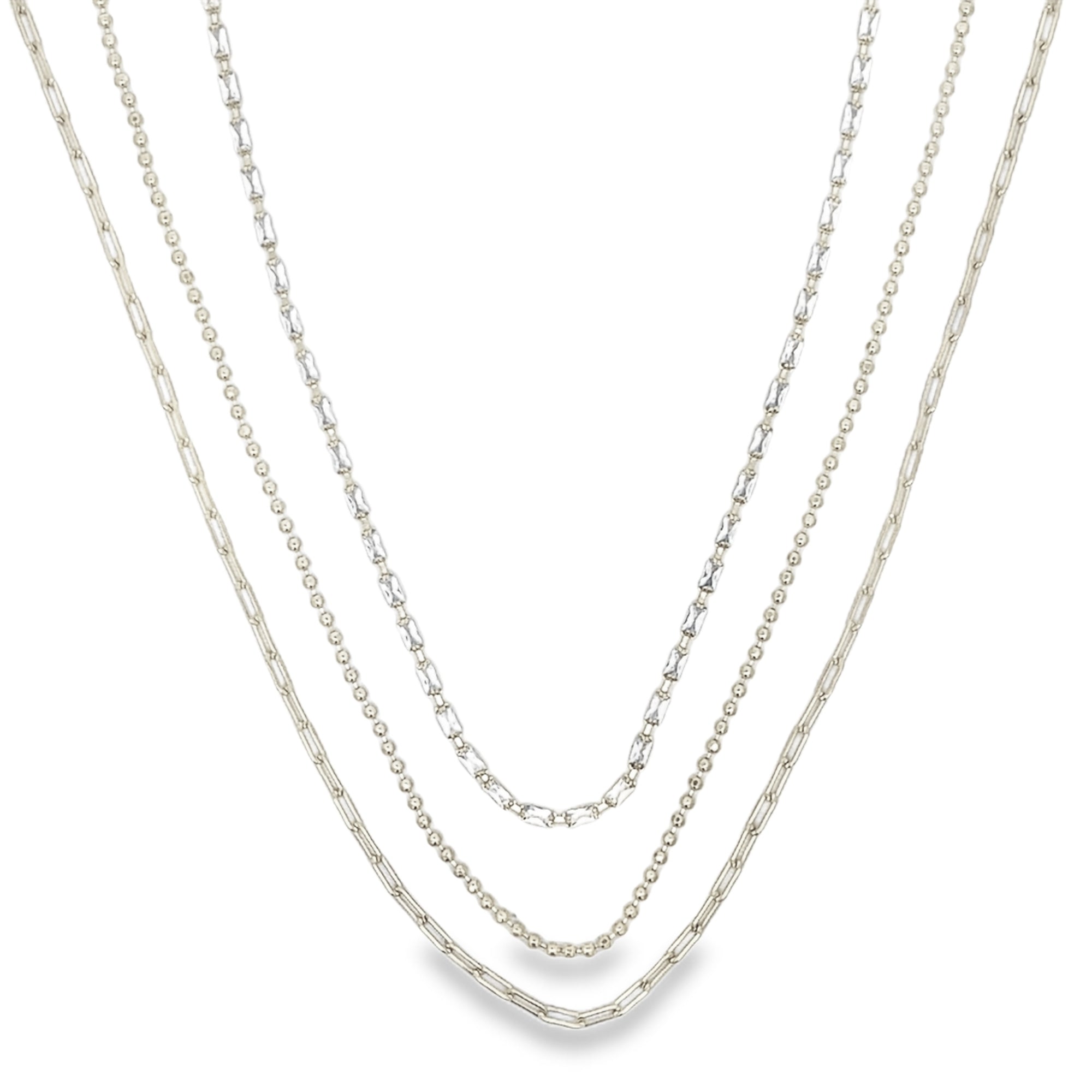 Modern triple layer necklace with paperclip, baguette and beaded chains. Minimalist layered jewelry available in gold or silver. Perfect for everyday wear.