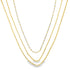 Modern triple layer necklace with paperclip, baguette and beaded chains. Minimalist layered jewelry available in gold or silver. Perfect for everyday wear.