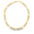 A polished yellow gold link necklace rests in a circular shape against a plain white background.