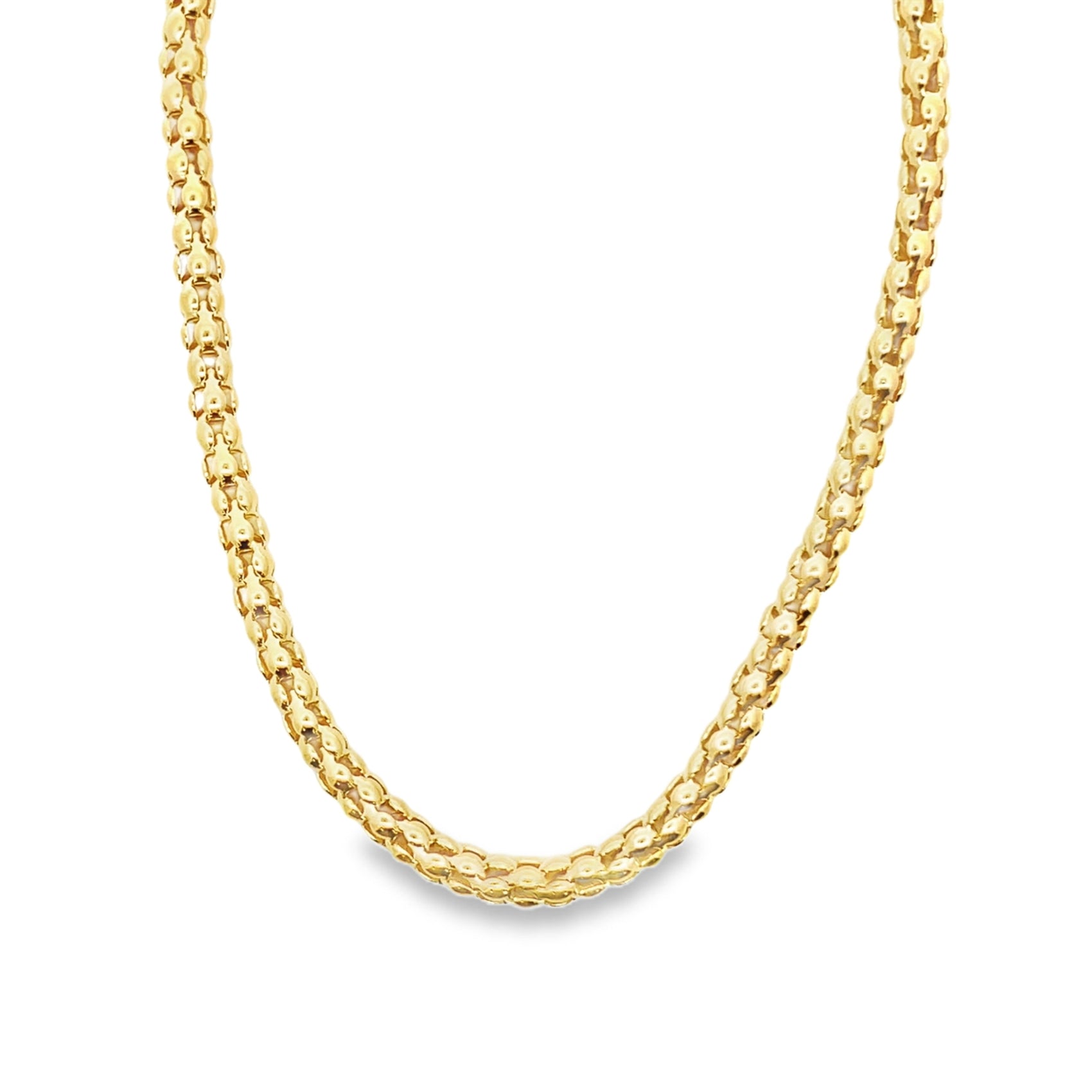 A thick, textured gold chain necklace rests against a plain white background.