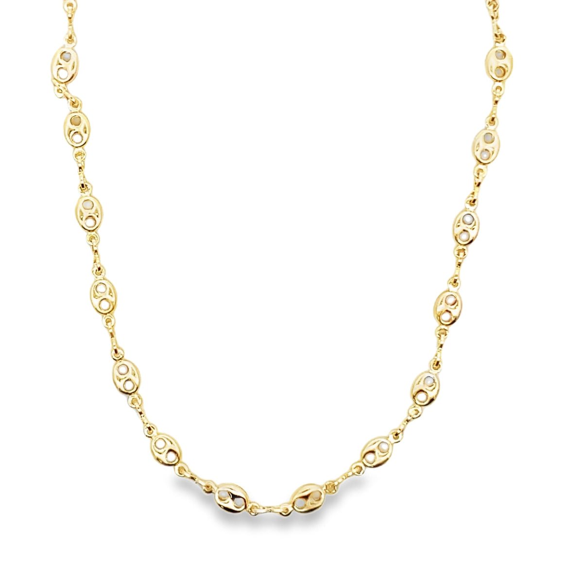A delicate gold chain necklace features intricate oval links against a clean white background.