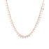 A delicate rose gold chain necklace features small, hanging paddle-like charms evenly spaced along its length against a white background.