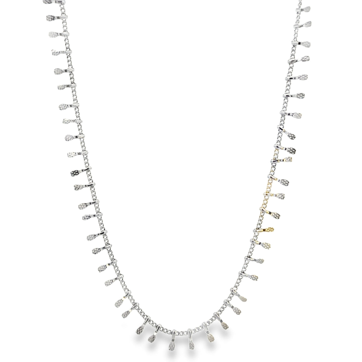 A delicate silver chain necklace features shimmering drop charms dangling evenly along its length.