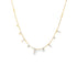 A delicate gold chain necklace drapes elegantly, featuring sparkling diamond charms dangling along its length against a clean white background.