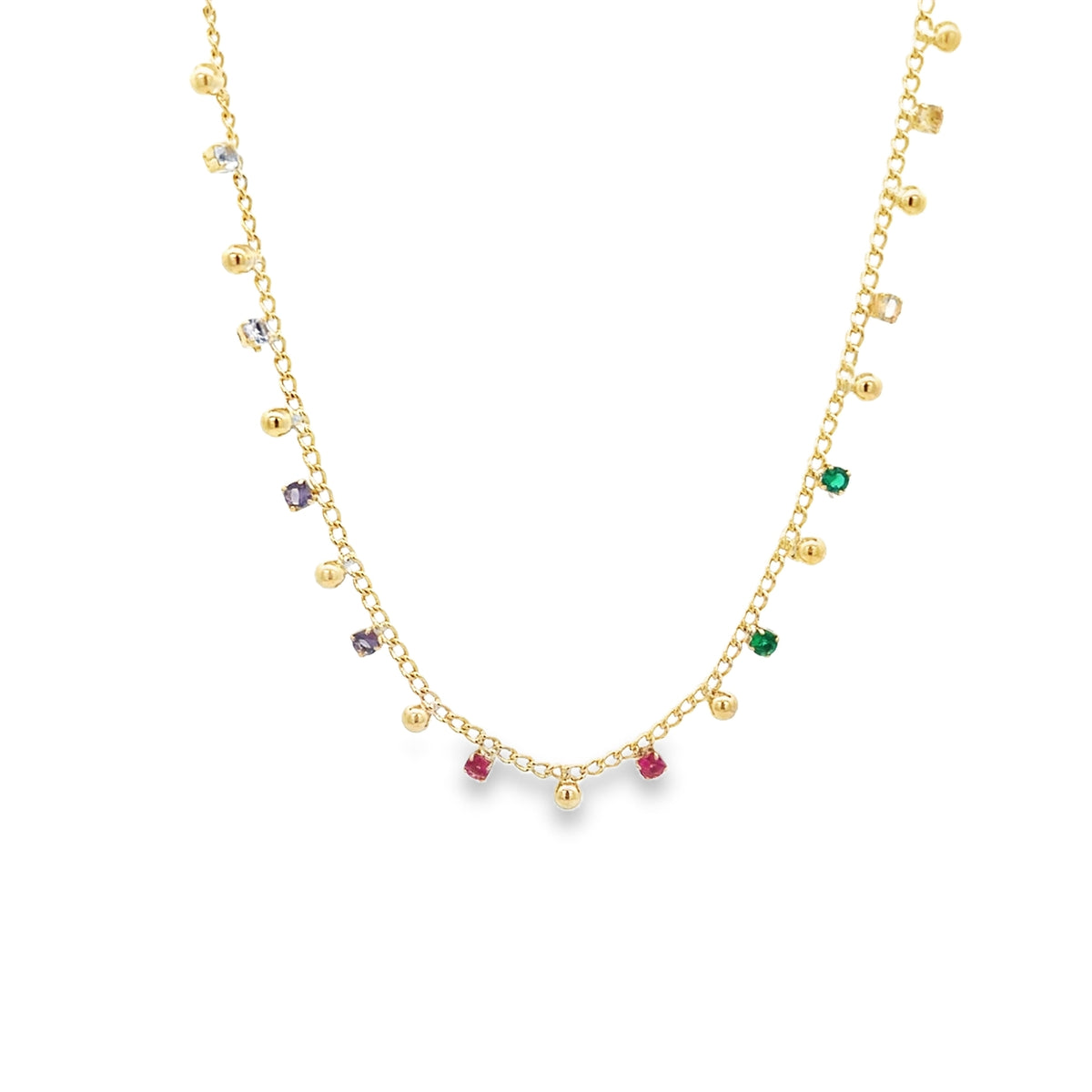 A delicate gold chain necklace dangles colorful gemstone charms and small gold beads against a clean white background.