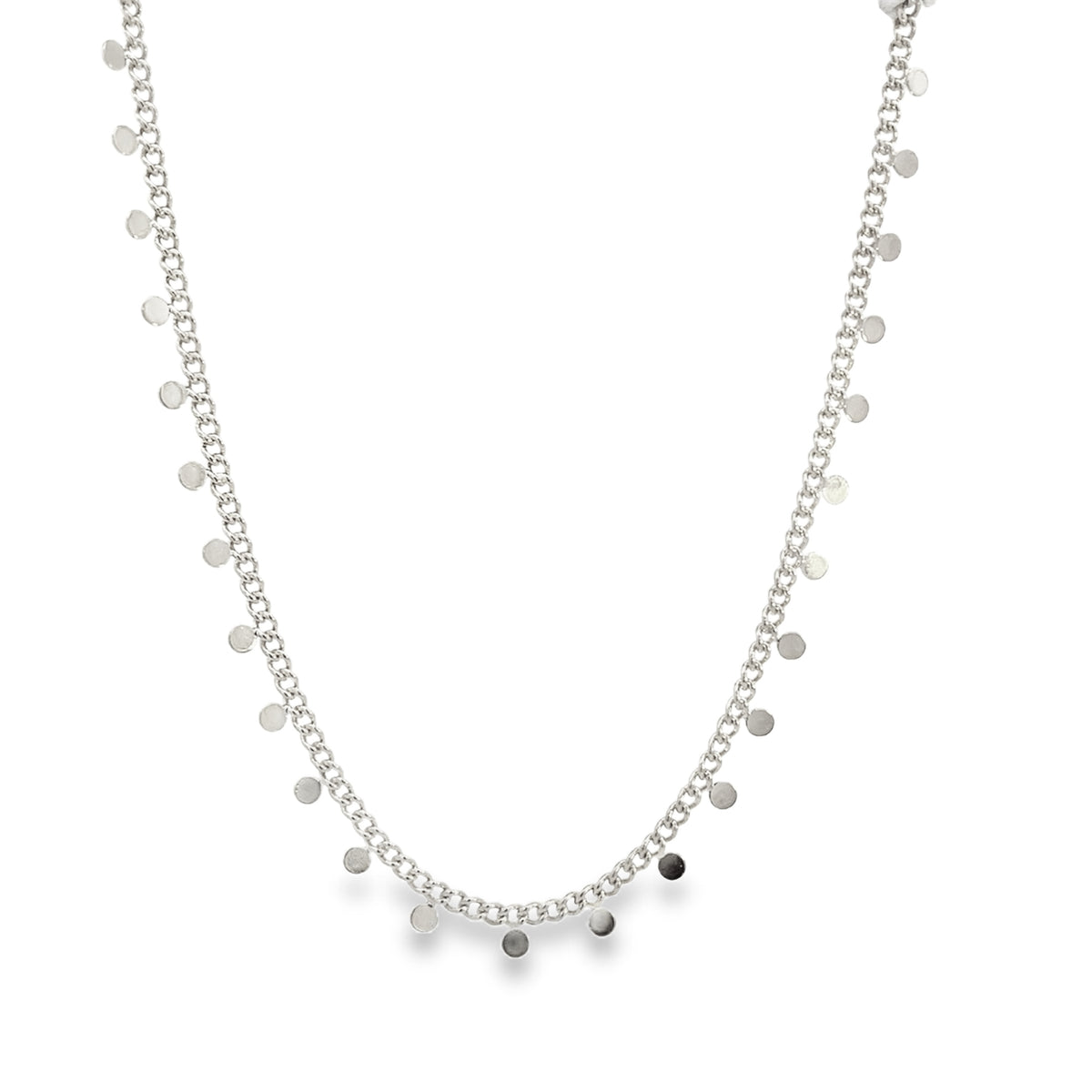 A delicate silver coin necklace hangs gracefully against a clean white background.