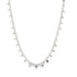 A delicate silver coin necklace hangs gracefully against a clean white background.