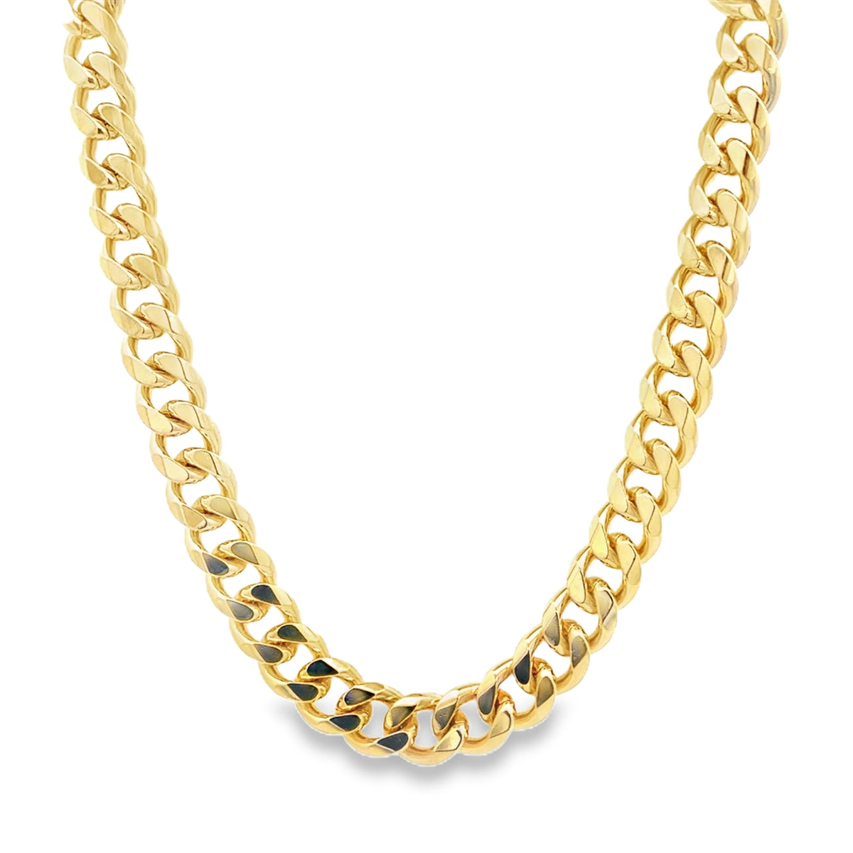 A thick gold Cuban link chain necklace gleams against a white background.