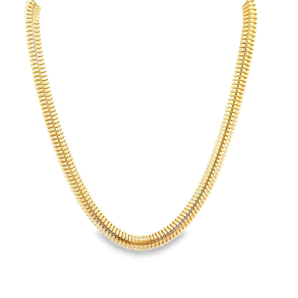 A thick, textured gold snake chain necklace curves gracefully against a clean white background.