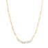 A delicate yellow gold Figaro chain necklace rests in a gentle curve against a clean white background.