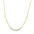 A delicate gold chain necklace drapes against a clean white background.