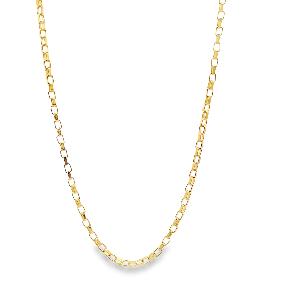 A delicate gold box chain necklace rests in a gentle curve against a clean white background.