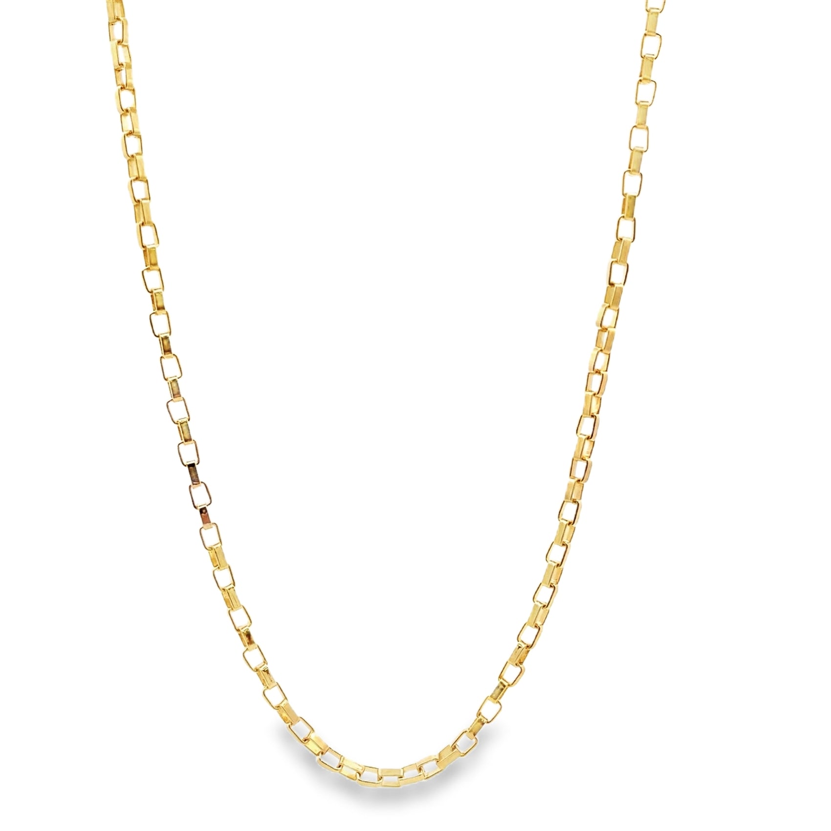 A delicate gold box chain necklace rests in a gentle curve against a clean white background.