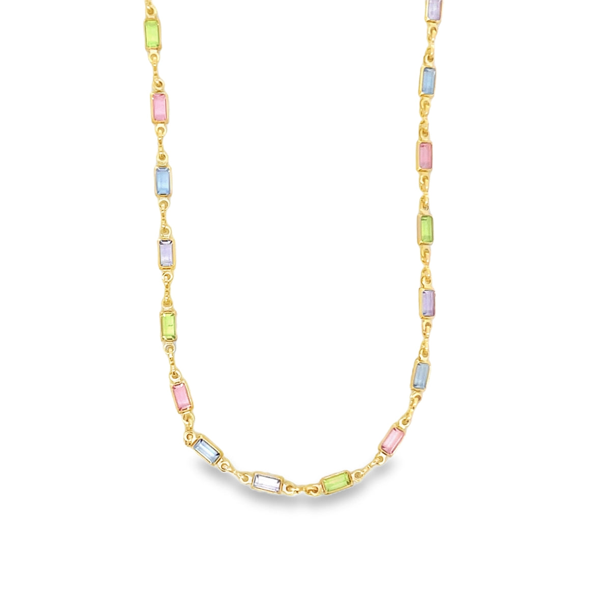 A gold chain necklace displays colorful, rectangular gemstone stations in pastel shades of pink, blue, green, and purple.