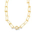 A glossy gold paperclip link necklace features delicate ball accents and a secure round clasp centered against a plain white background.