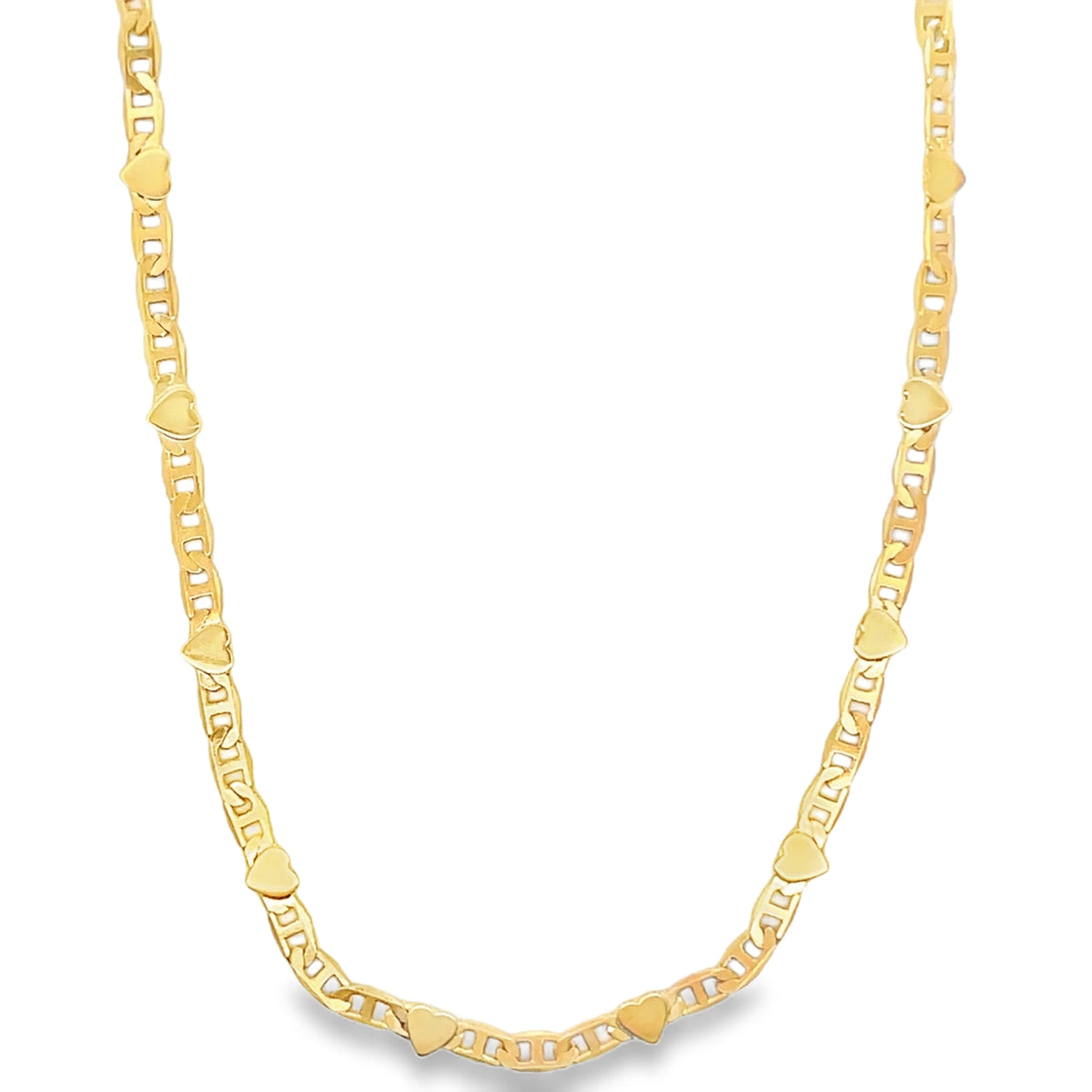 A delicate yellow gold chain necklace features alternating anchor links and small heart charms.