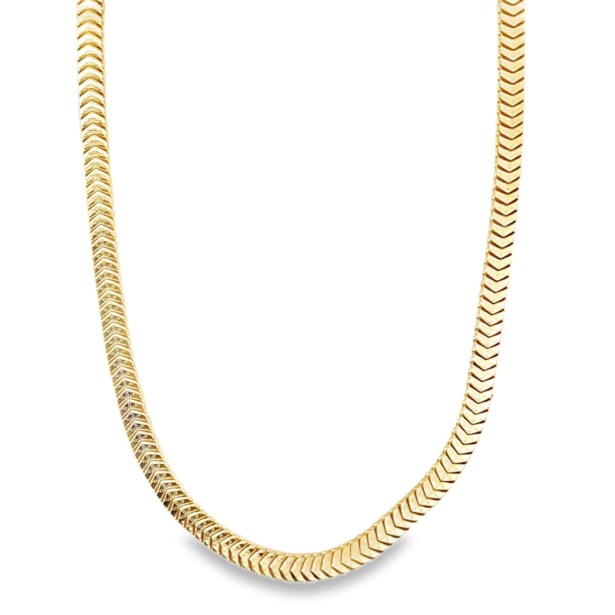 A shiny gold herringbone chain necklace curves gracefully against a plain white background.