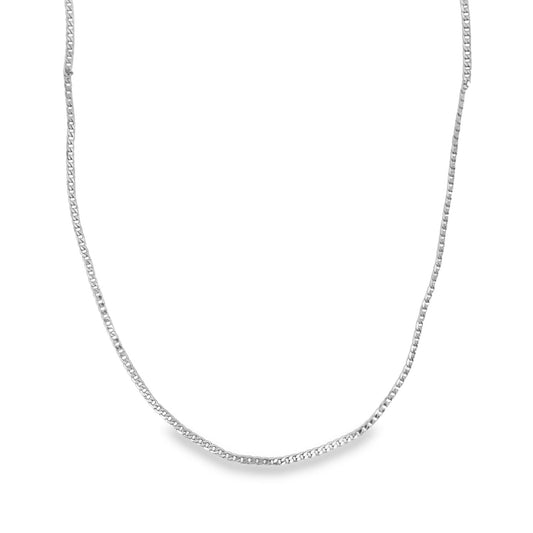 A delicate silver curb chain necklace rests in a gentle curve against a clean white background.