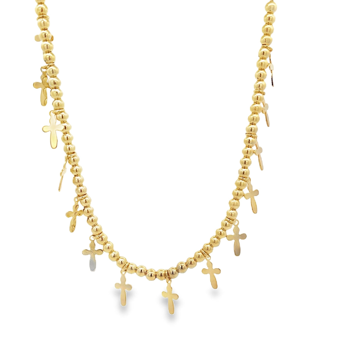 A gold beaded necklace features multiple hanging cross charms against a plain white background.