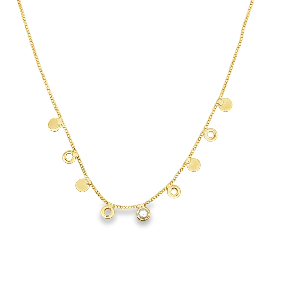 A delicate gold chain necklace dangles charmingly with alternating round discs and sparkling diamond charms.