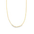 A sleek gold paperclip chain necklace drapes against a clean white background.