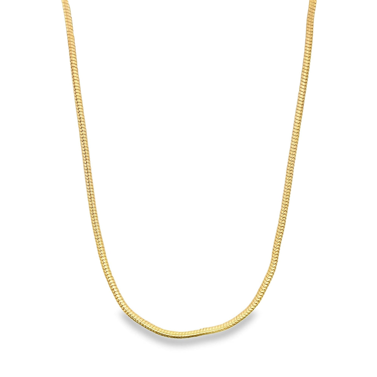 A delicate gold snake chain necklace rests against a clean white background.