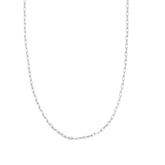 A delicate silver paperclip chain necklace drapes against a clean white background.