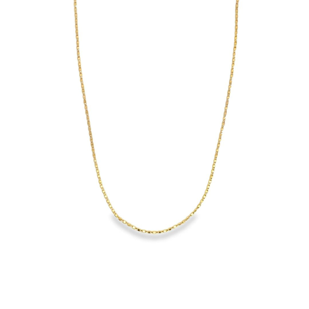 A delicate gold link chain necklace hangs against a clean white background.