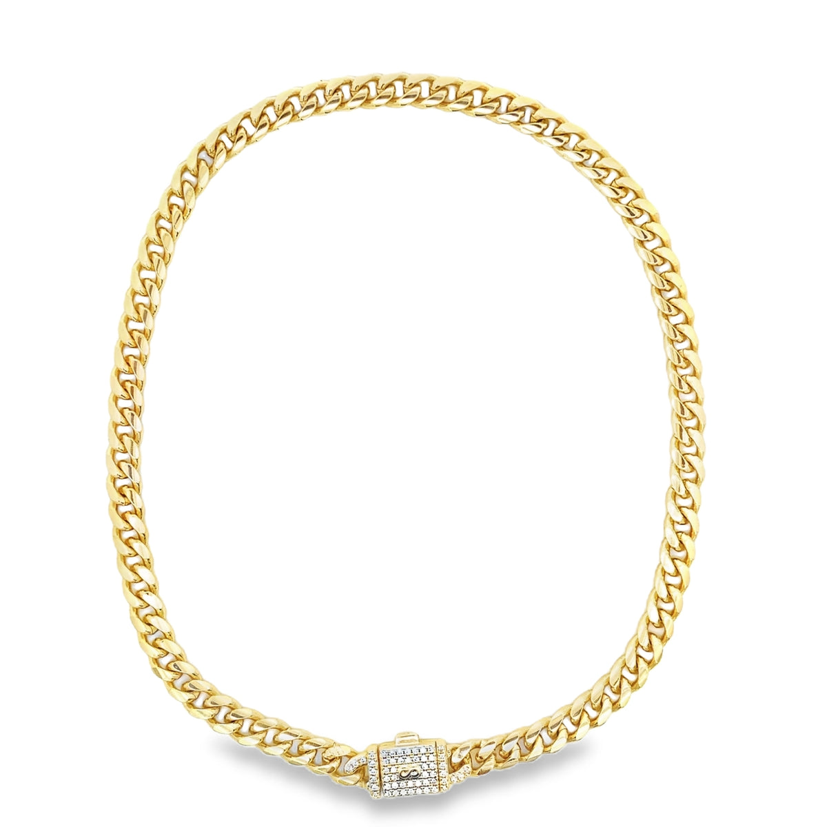 A polished gold Miami cuban link chain necklace glistens with a diamond-paved clasp centered at the bottom.