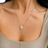 Elegant 18K gold filled rosary necklace featuring a Virgin Mary medal and cross pendant. Available in multiple sizes and thickness options for timeless everyday wear.