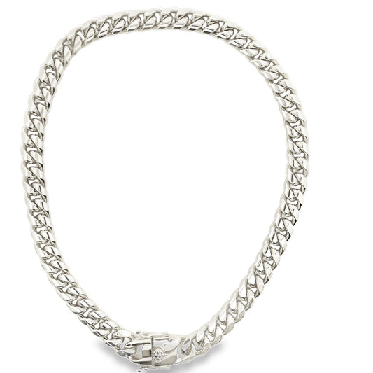 A thick, polished silver Cuban link chain necklace curves gracefully against a clean white background.