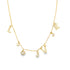A delicate gold charm necklace sparkles against a white background, featuring pavé-set crystal charms that spell out "LOVE" alongside tiny hearts and round stones.