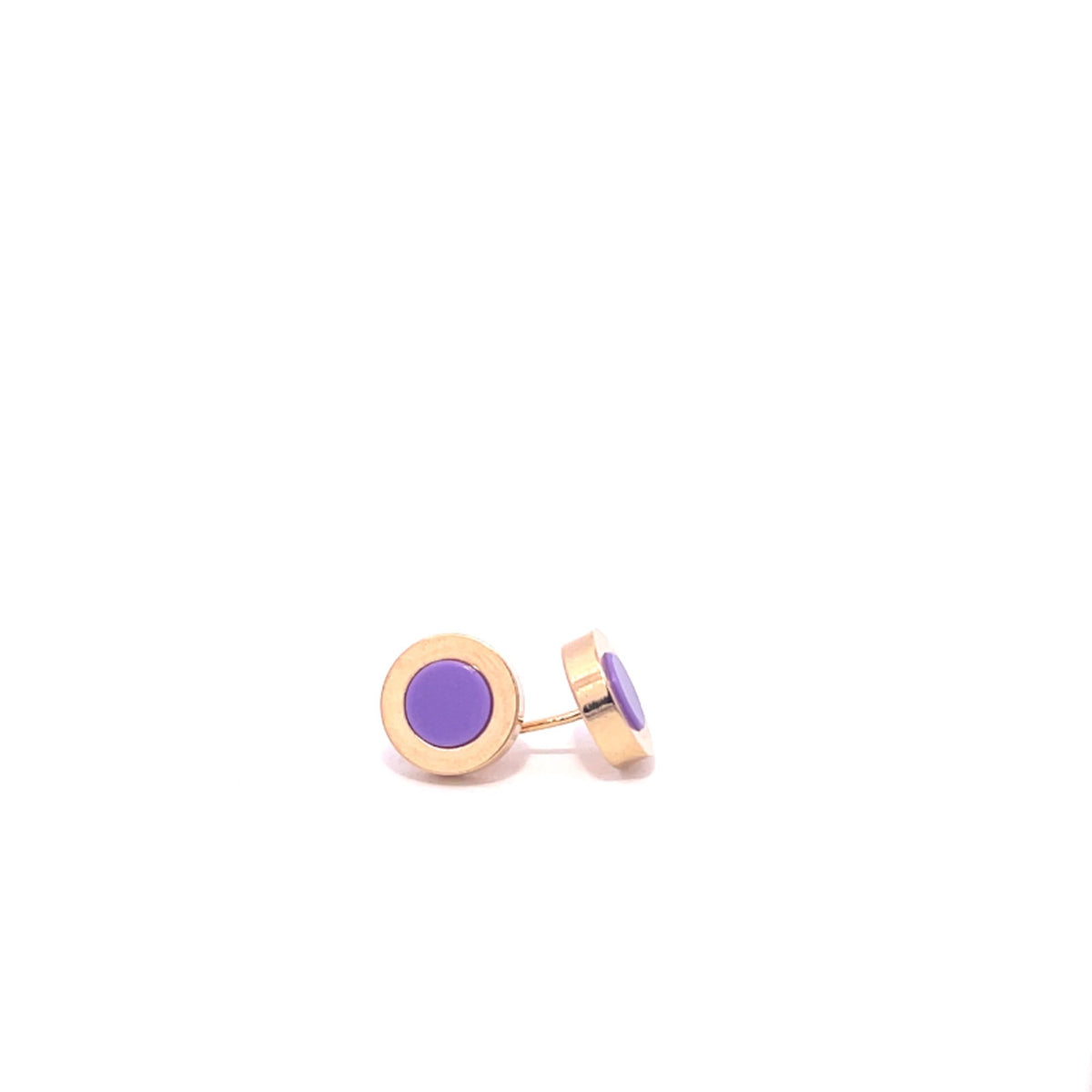 A pair of round gold stud earrings featuring vibrant purple enamel centers rests against a clean white background.