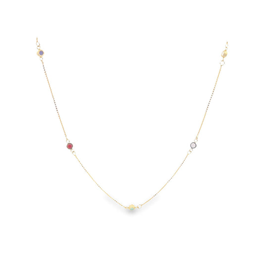 A delicate gold chain necklace sparkles with colorful gemstone stations.
