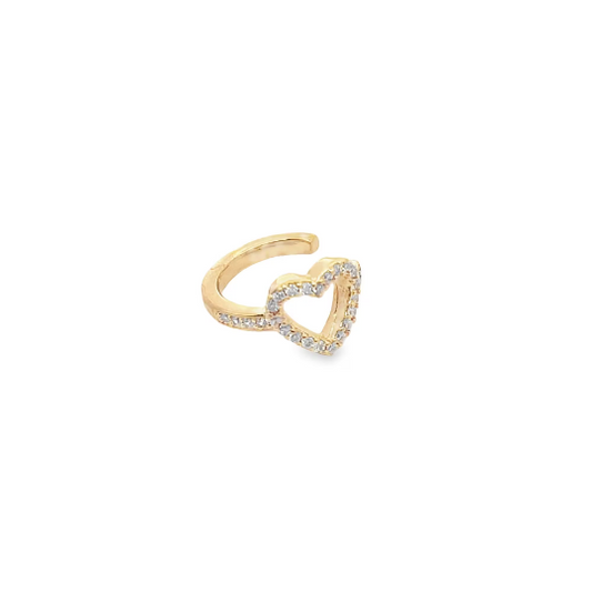 A gold heart-shaped ear cuff sparkles with small pavé diamonds against a plain white background.