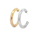 A pair of thick, polished gold and silver hoop earrings rests against a clean white background.