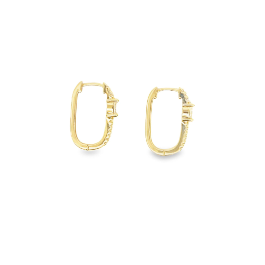A pair of gold huggie hoop earrings featuring sparkling pave-set diamonds along the outer edge rests against a white background.