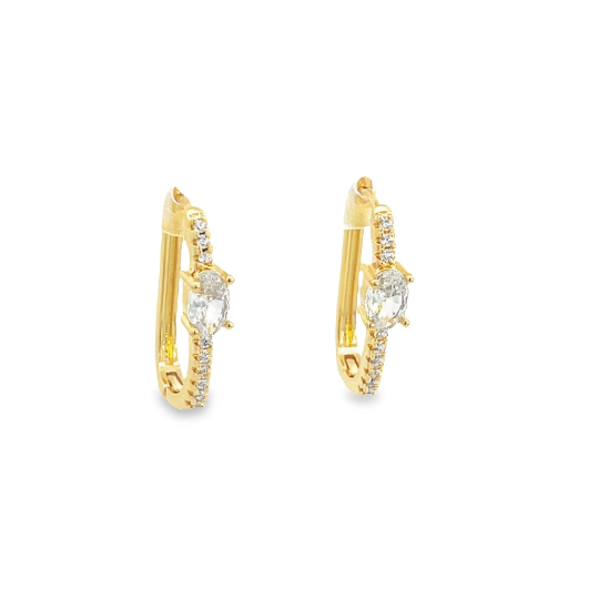 A pair of gold hoop earrings features sparkling pavé-set diamonds and a central marquise-cut stone against a clean white background.