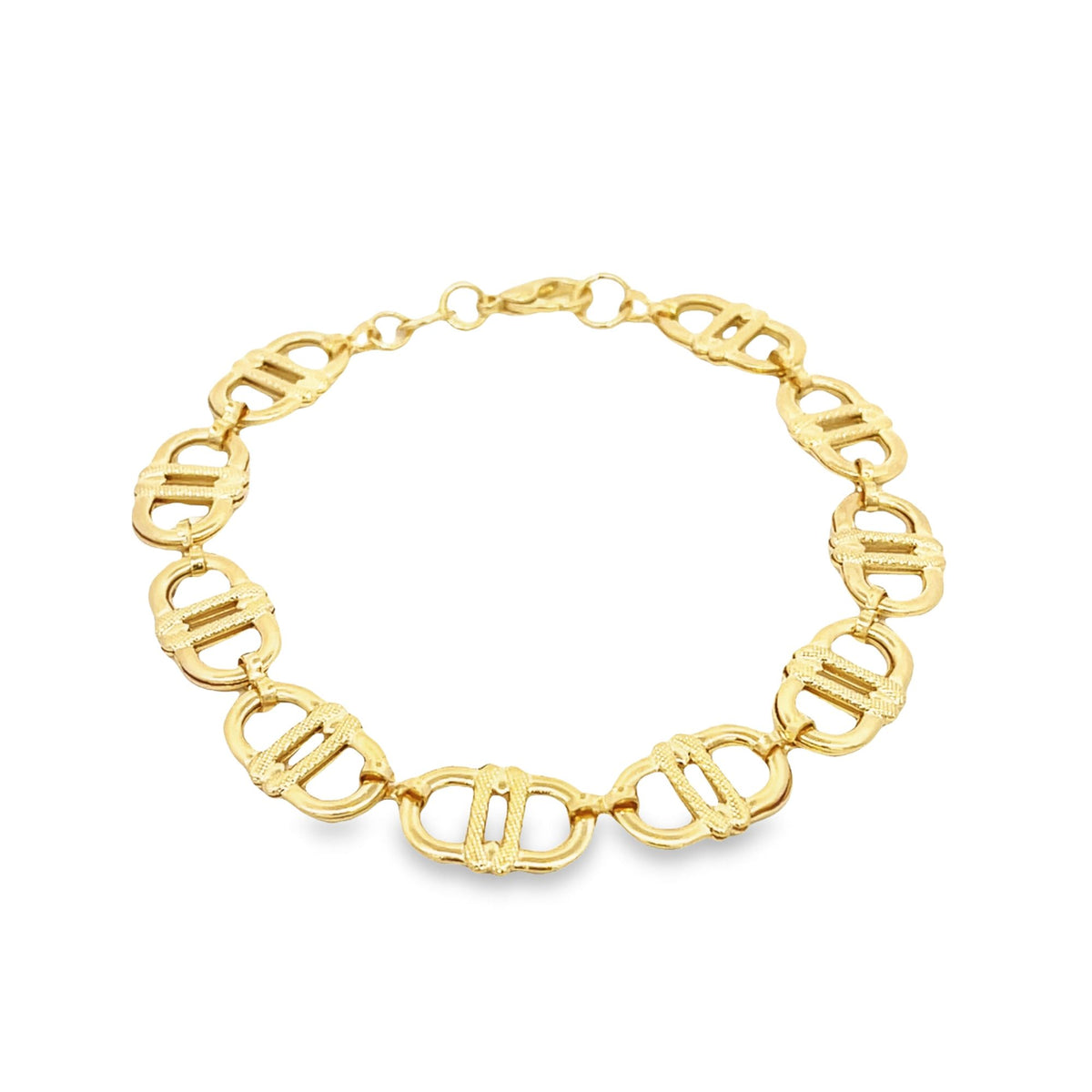 A polished gold link bracelet rests in a circular display against a clean white background.