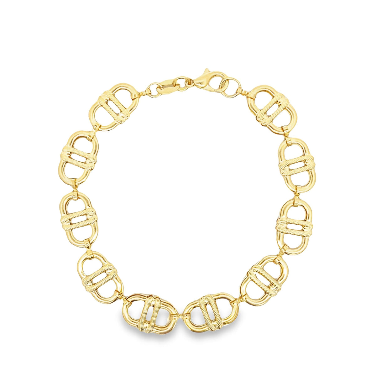 A gold link chain necklace featuring textured oval links lies in a circular shape against a white background.