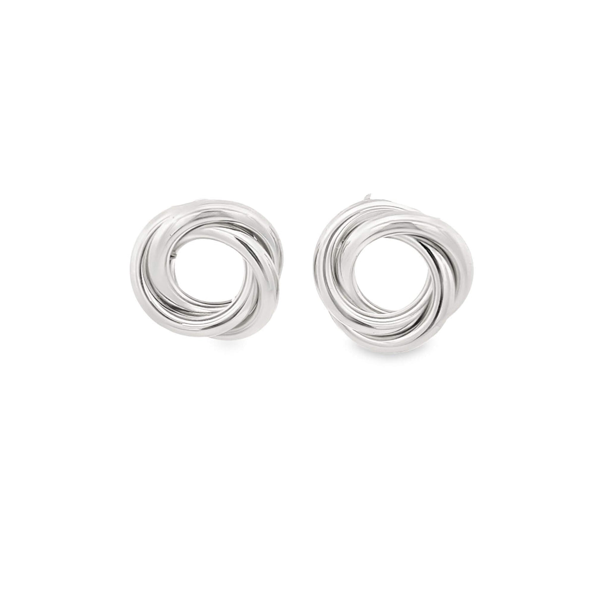 A pair of gleaming silver knot stud earrings displays intertwined loops against a clean white background.