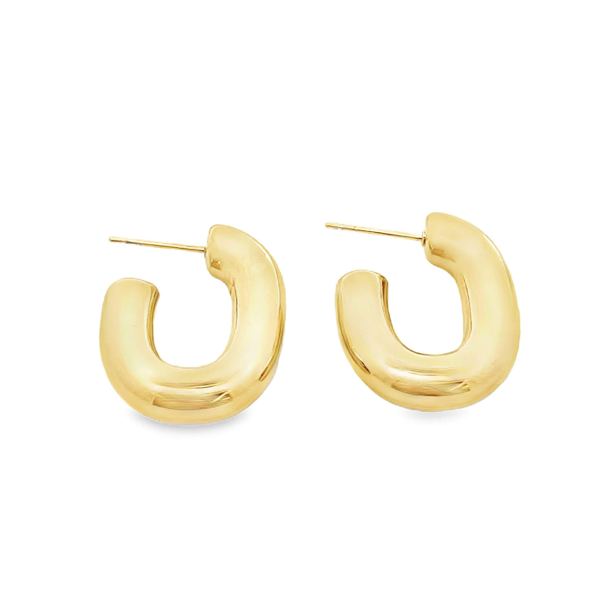 A pair of thick, polished gold hoop earrings rests against a clean white background.