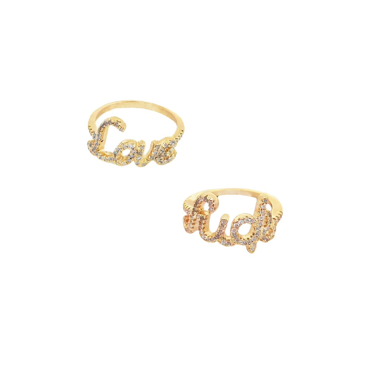 Two gold pavé diamond-encrusted rings spell out the words "love" and "rich" against a clean white background.