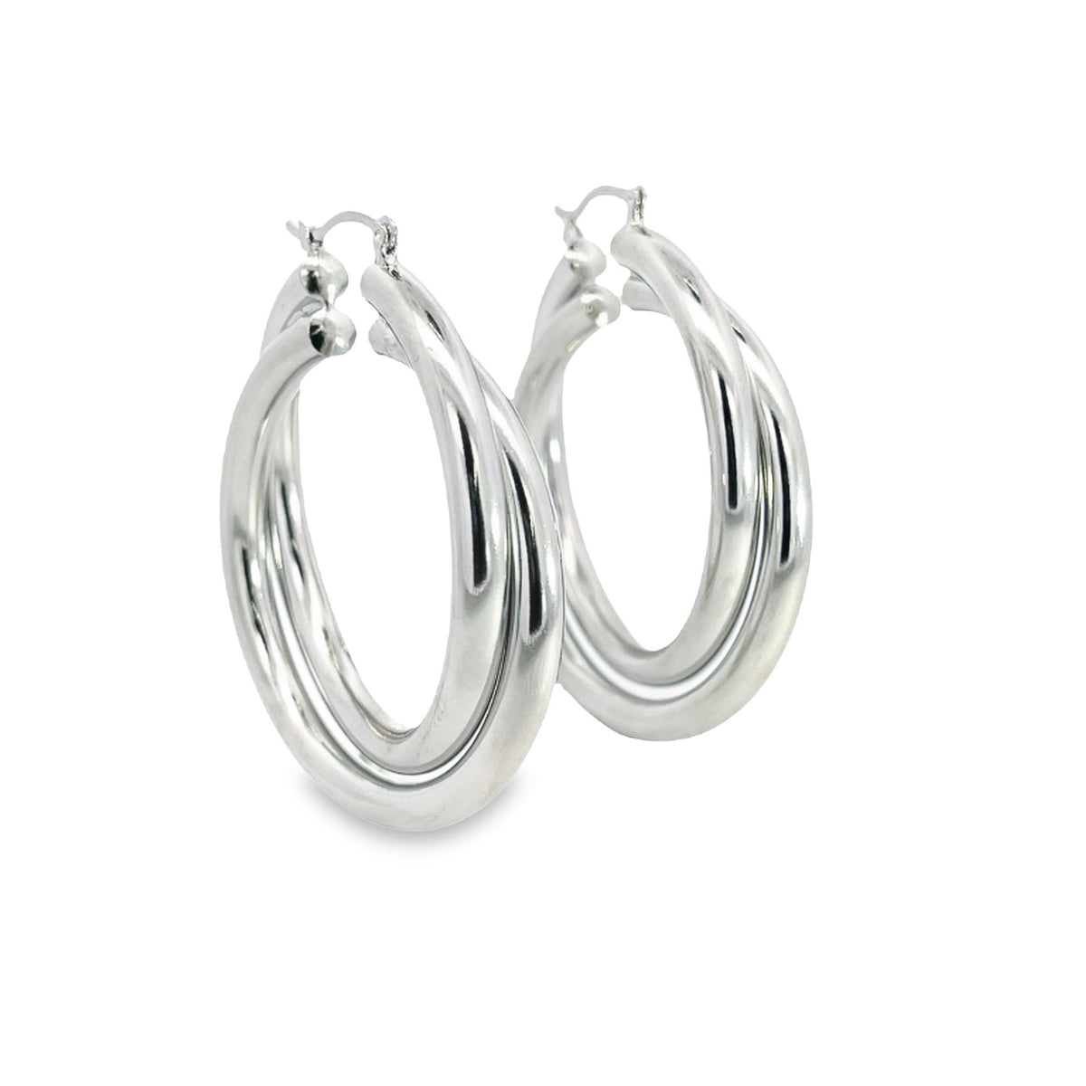 A pair of polished silver double-hoop earrings gleams against a clean white background.