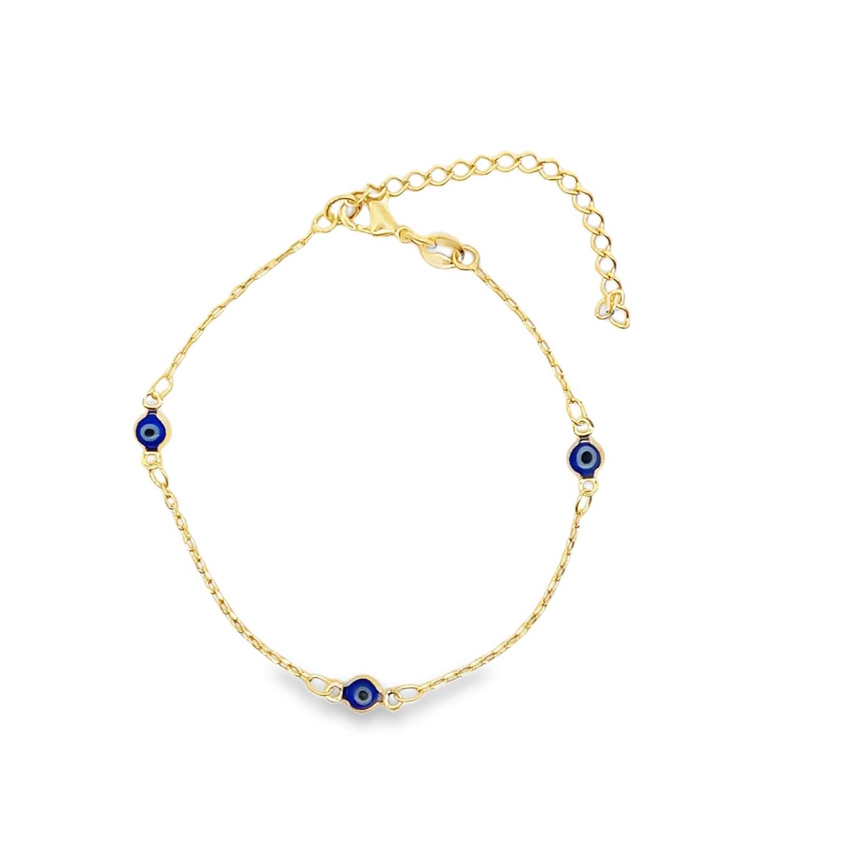 A delicate gold chain bracelet features three blue and white evil eye charms against a clean white background.