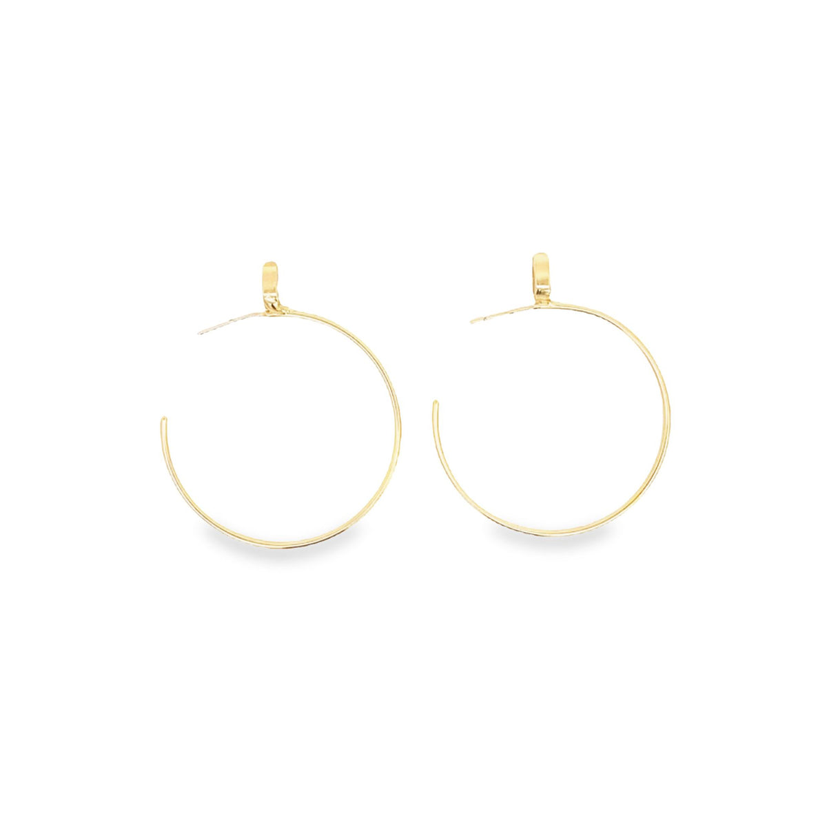 A pair of elegant gold hoop earrings gleams against a clean white background.